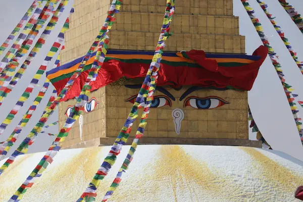 Boudhanath Stupa eyes with colorful prayer flags in Kathmandu, Nepal