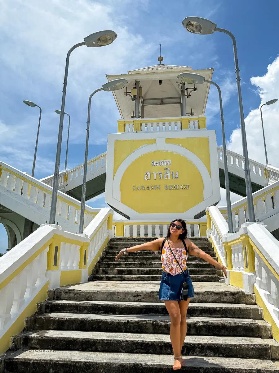 Traveler on the steps of Sarasin Bridge, the historic gateway from Phuket to the mainland.