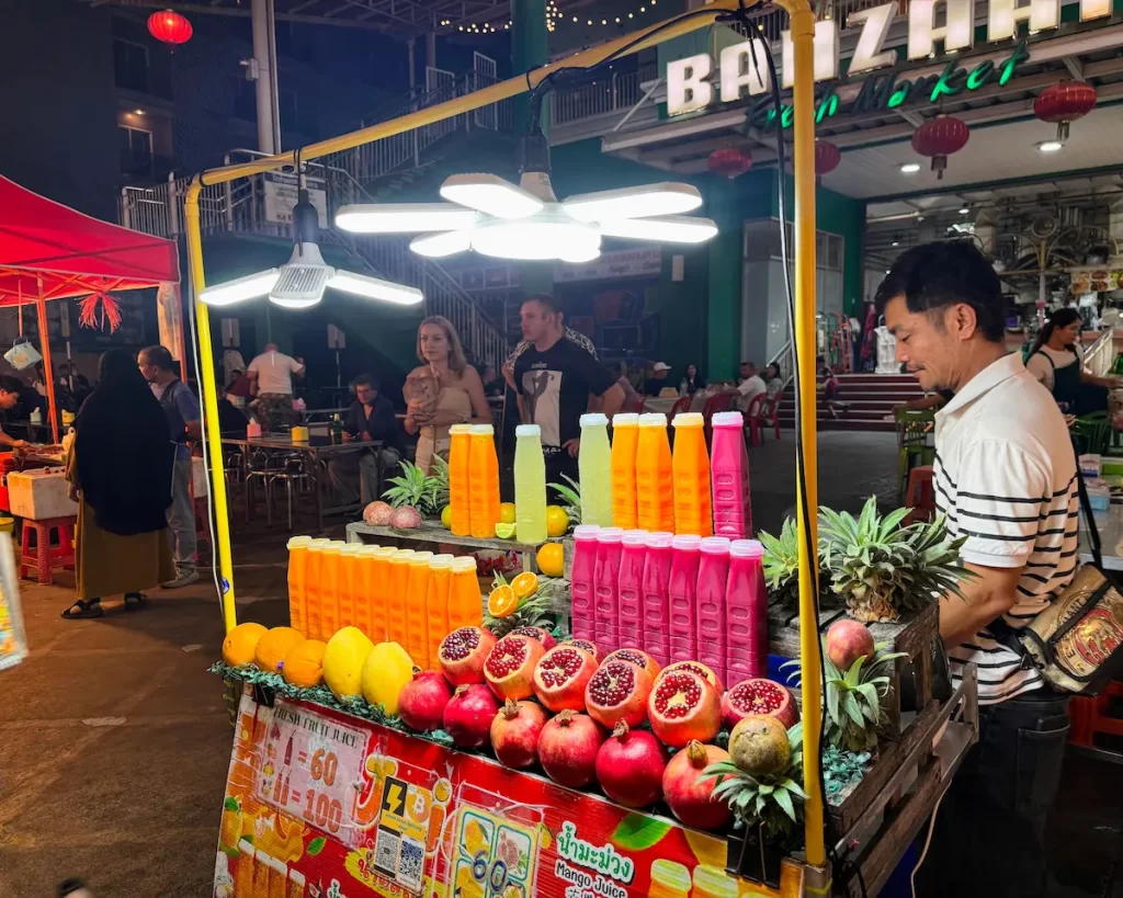 Fresh fruit juice stall outside Banzaan Market in Patong Phuket at night
