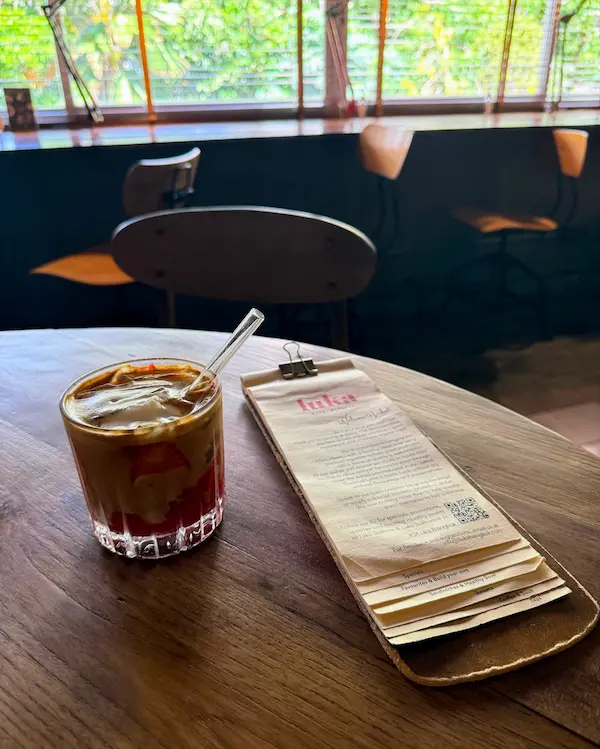 Coffee and café table during a slow travel morning in Thailand